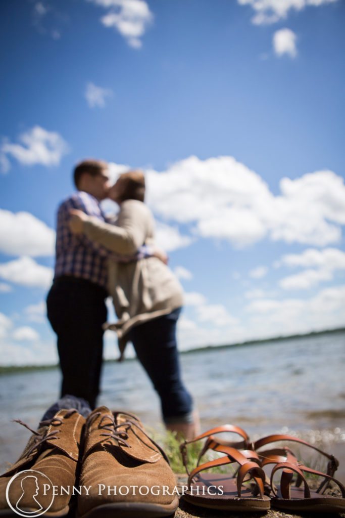Harriet Island Engagement Session couple kisses on the beach
