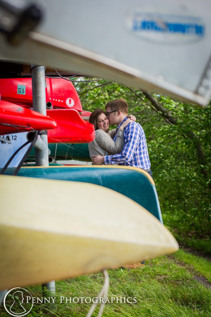 Harriet Island Engagement Session stealing a kiss by the boat dock