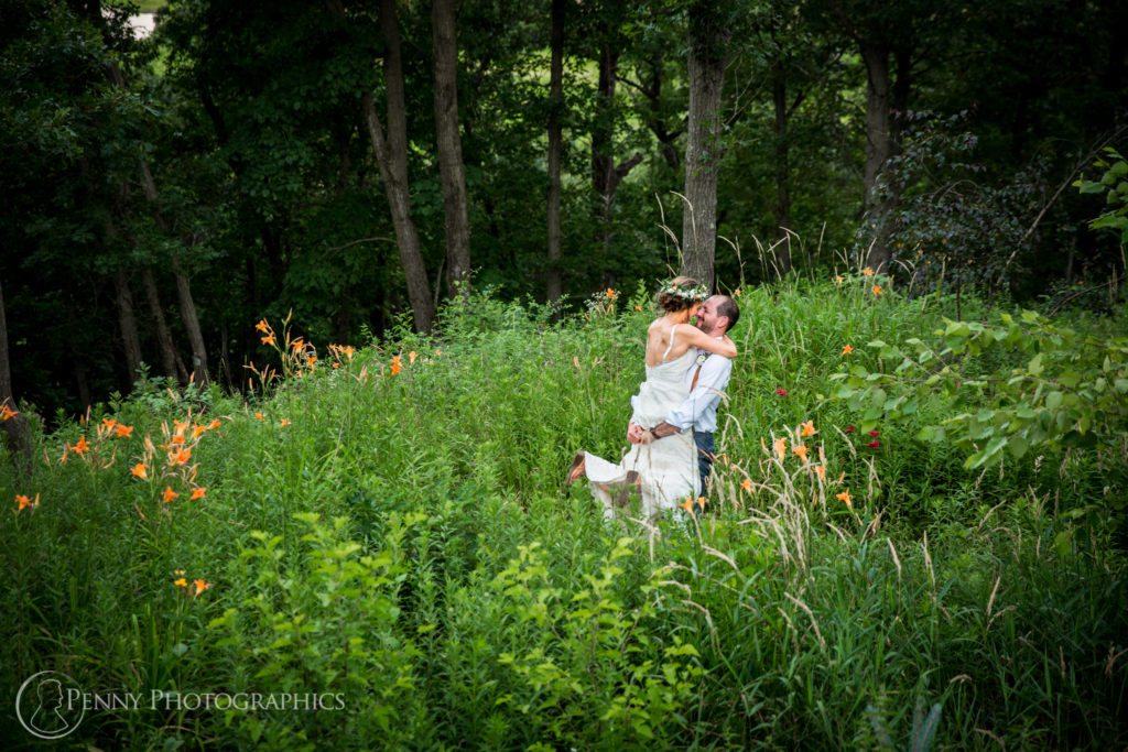Summer Wedding couple in wildflowers