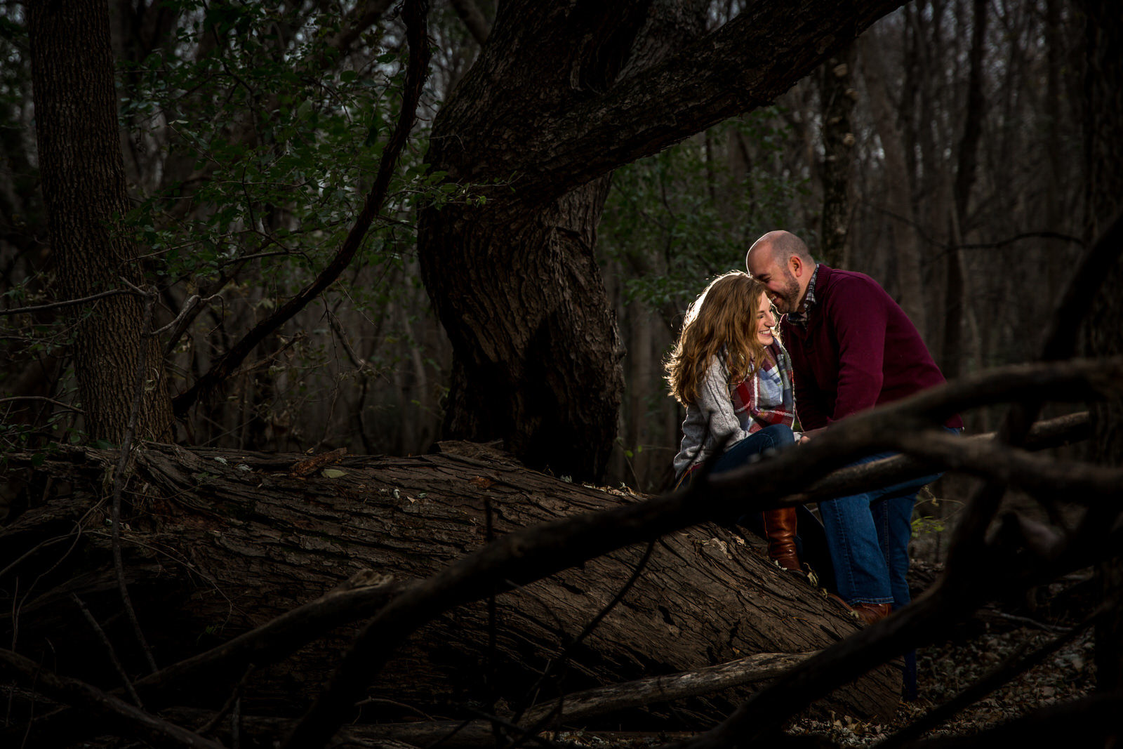 Wildwood Park Engagement Session couple sharing stories in the woods