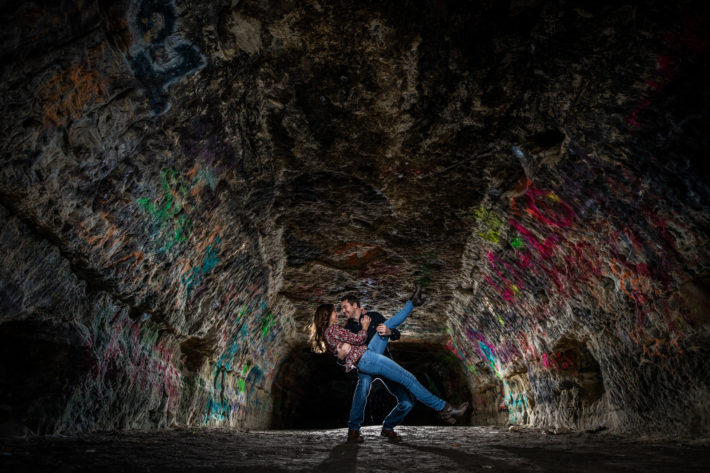 Stillwater Engagement Session couple dips in a cave