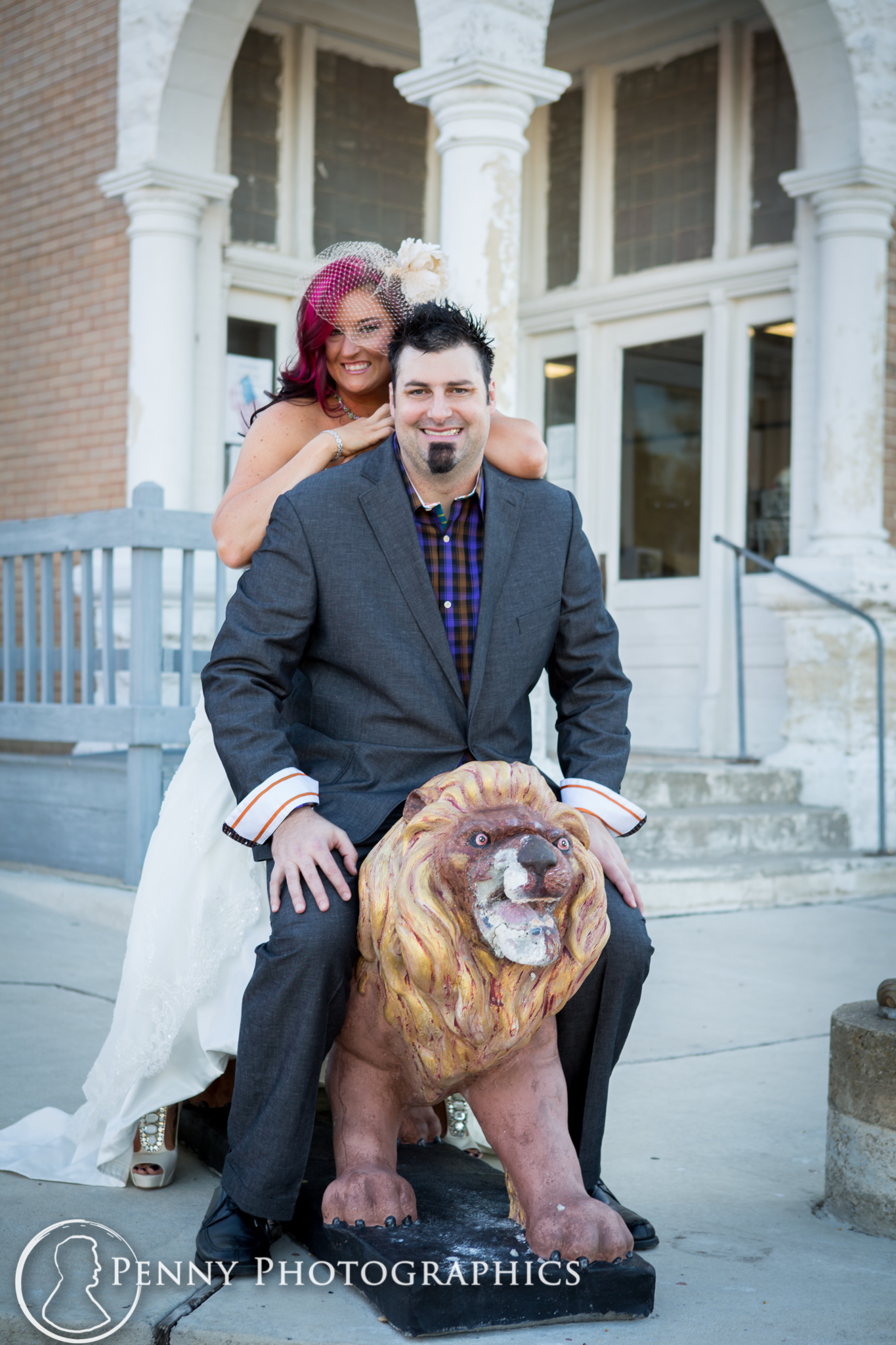 bride and groom on lion statue