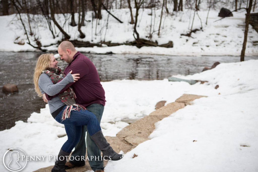 Frozen Falls Engagement couple dip by a frozen lake
