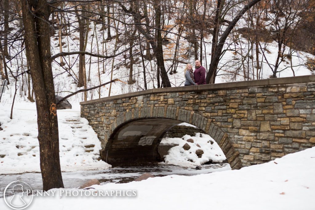 Frozen Falls Engagement couple on winter bridge