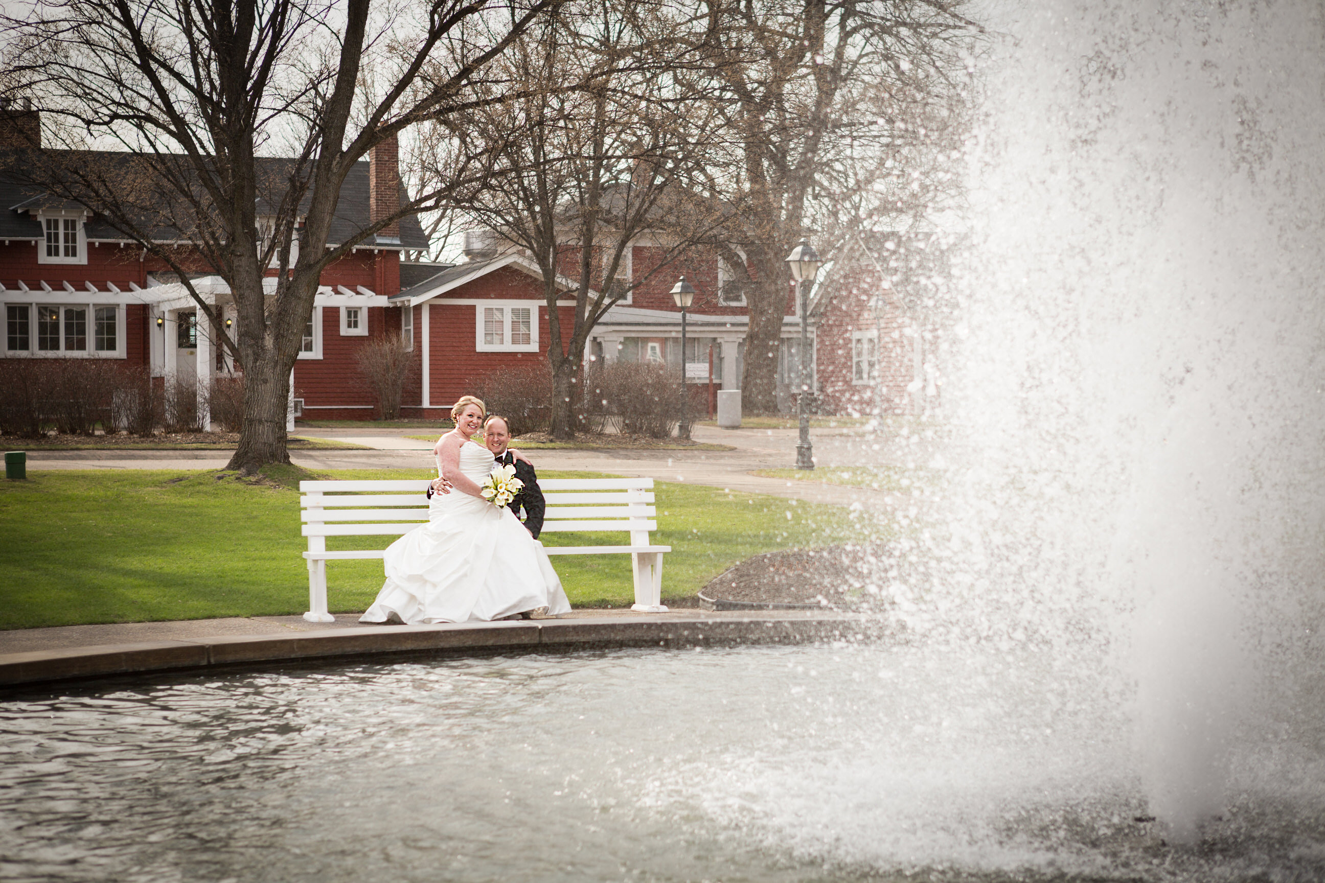 Bride and Groom by water fountain