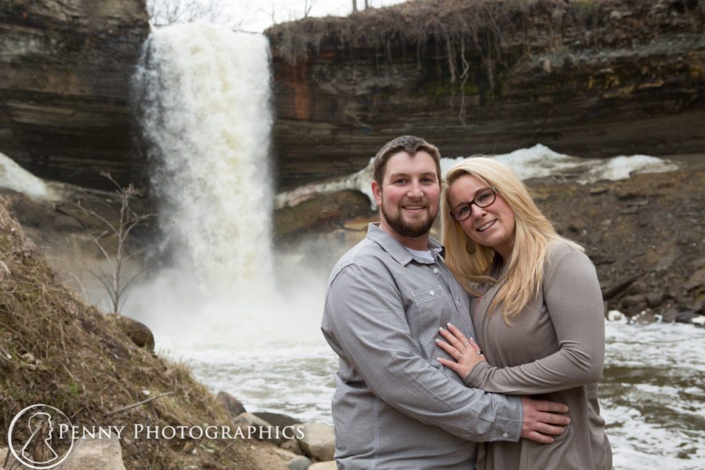 Colorful Cave Engagement Couple standing by the falls