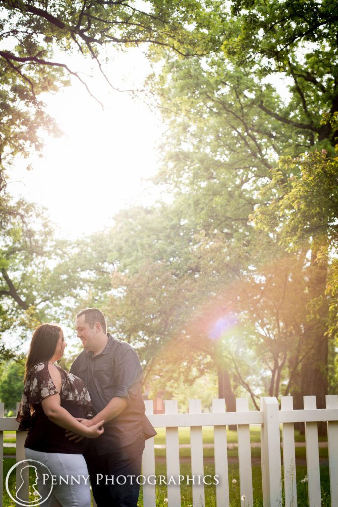 Outdoor Minnehaha Engagement sunshine and picket fences
