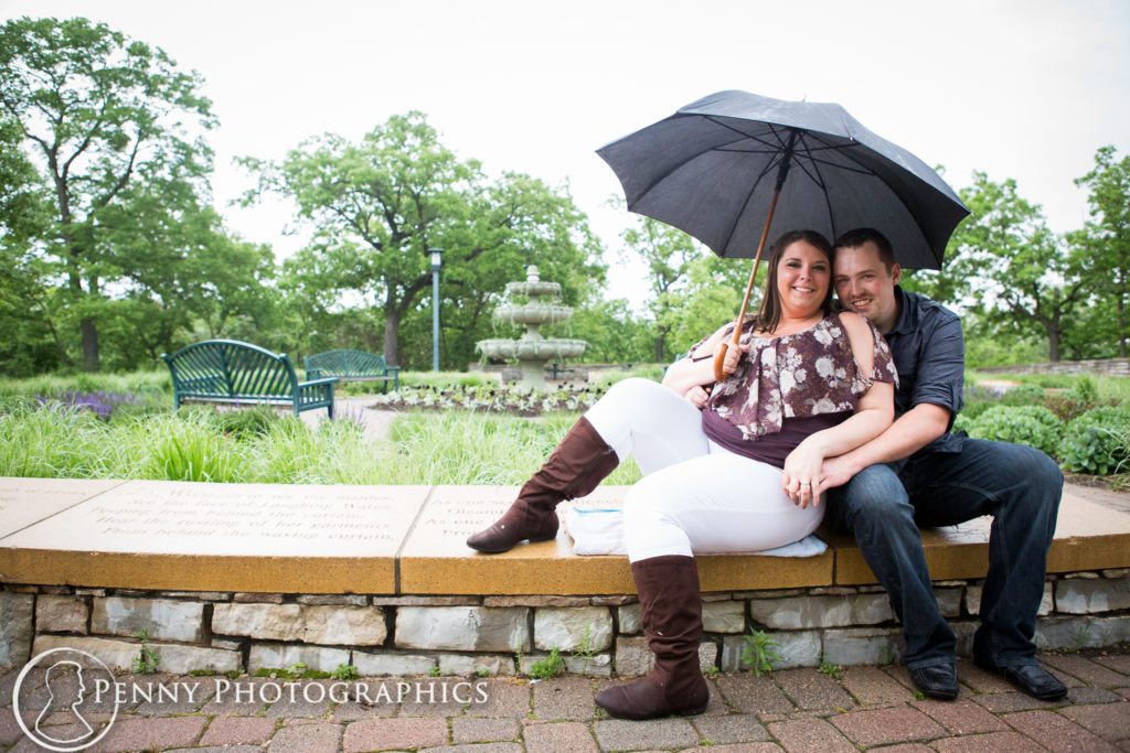 Outdoor Minnehaha Engagement couple under the umbrella