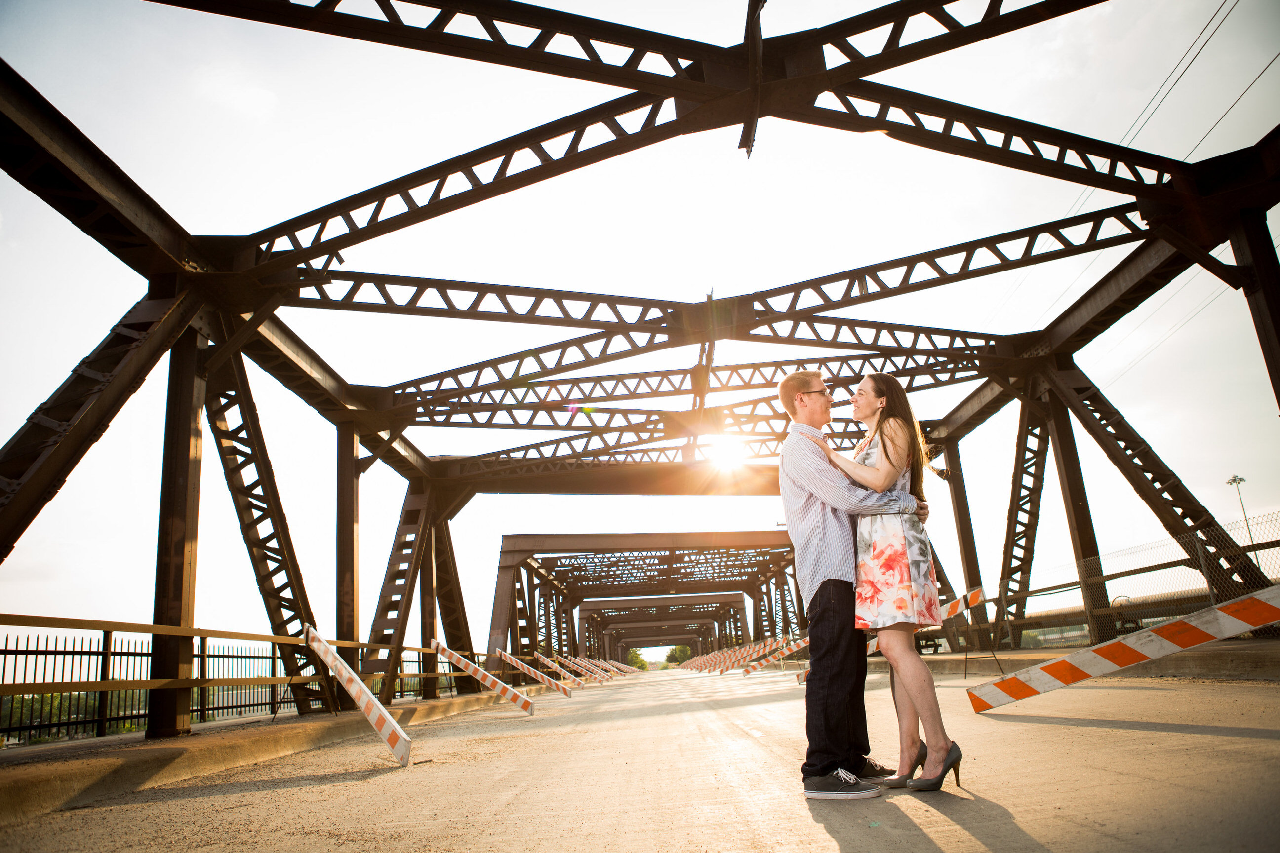 Couple under a bridge