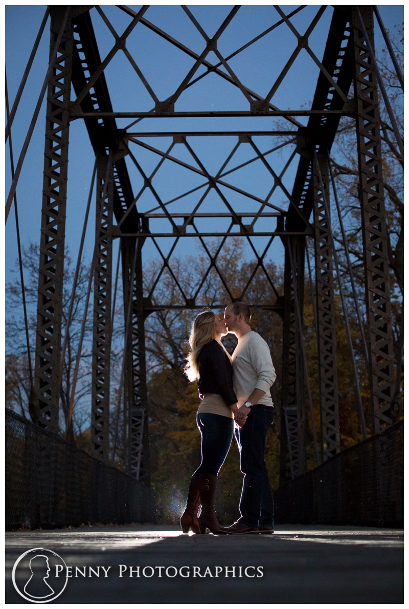 Romantic night kiss under steel bridge Minneapolis