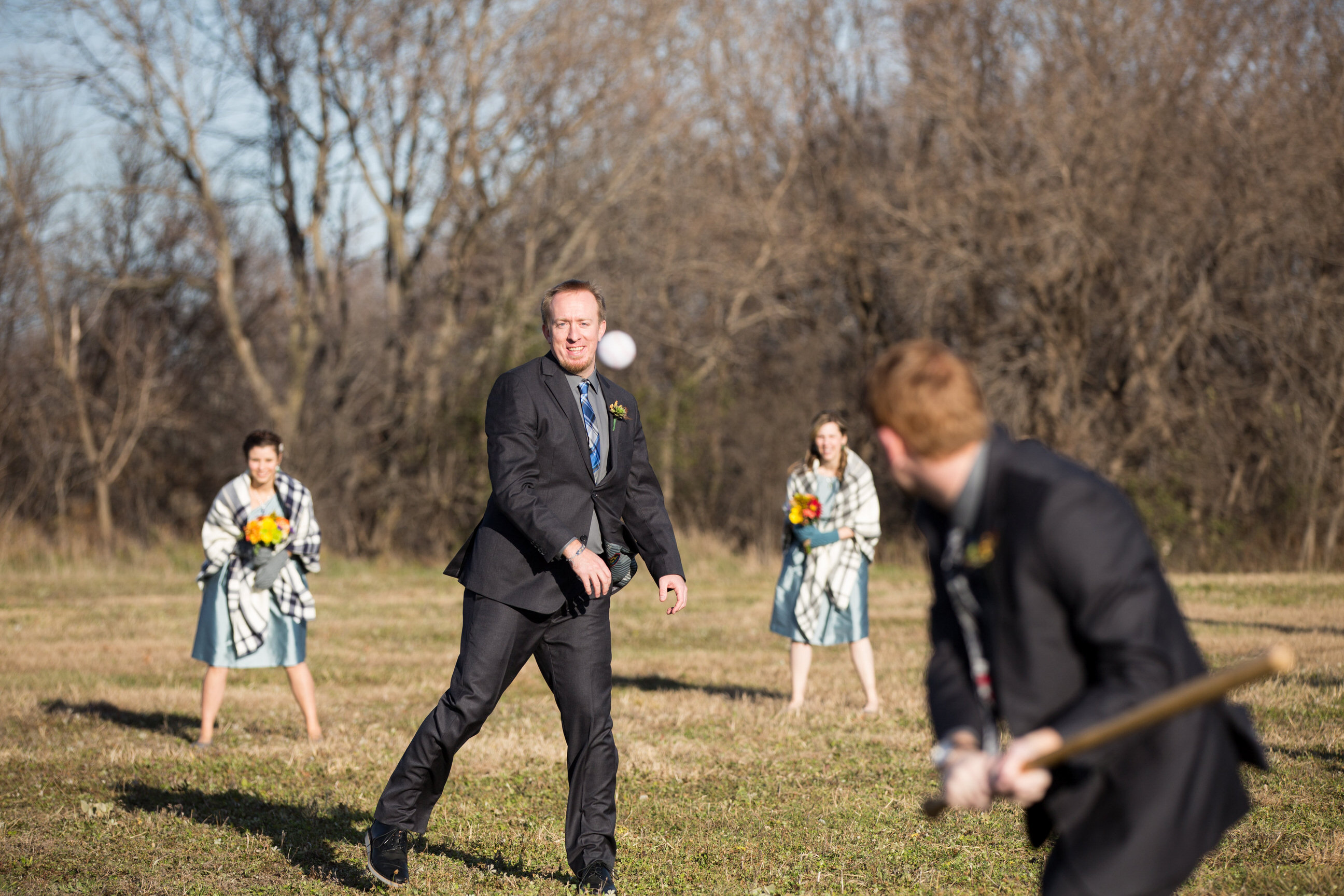 Wedding party playing baseball