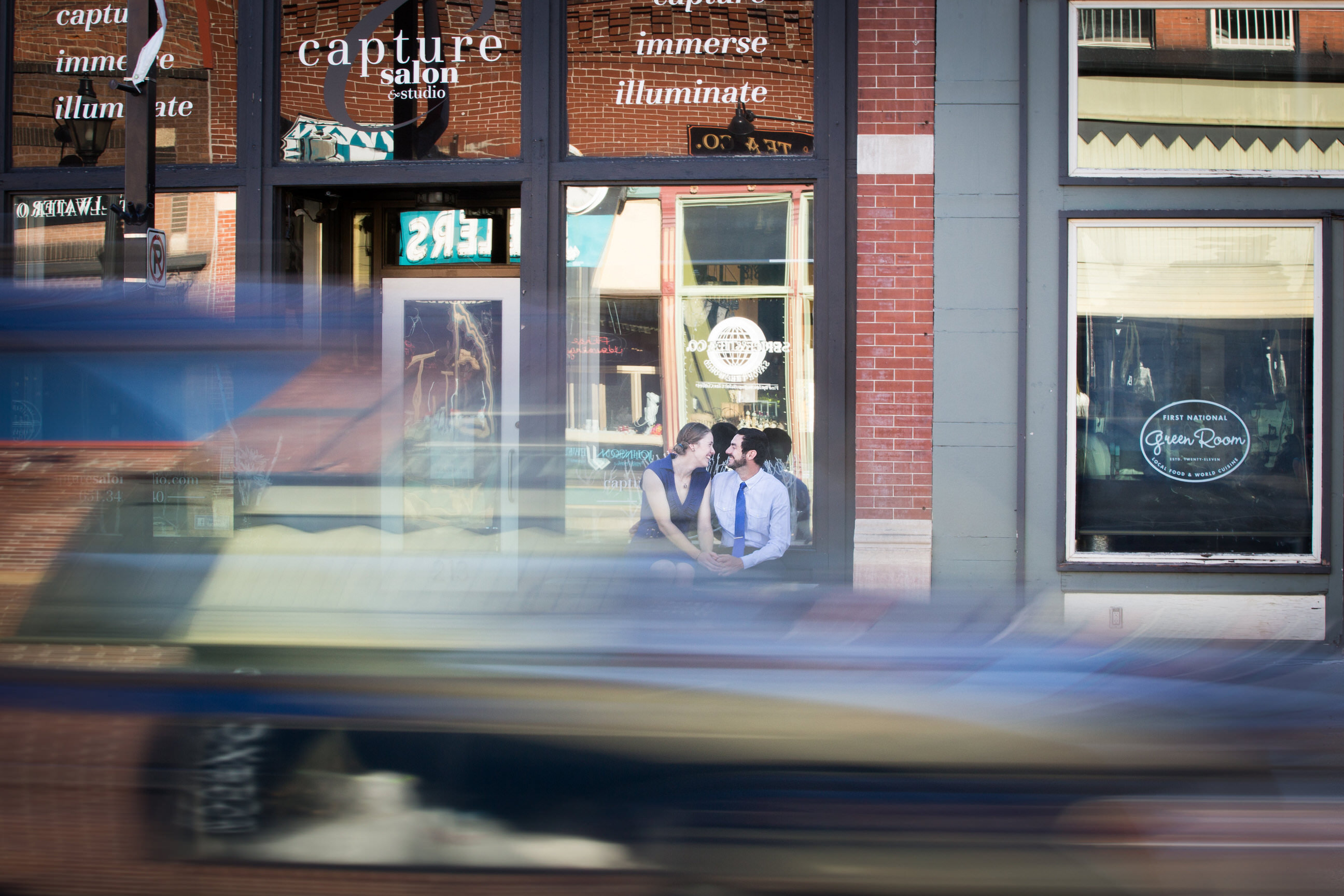 Couple sitting with car motion blur