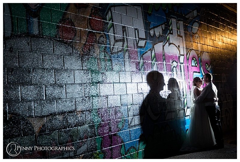Huber Park Wedding couple against graffiti
