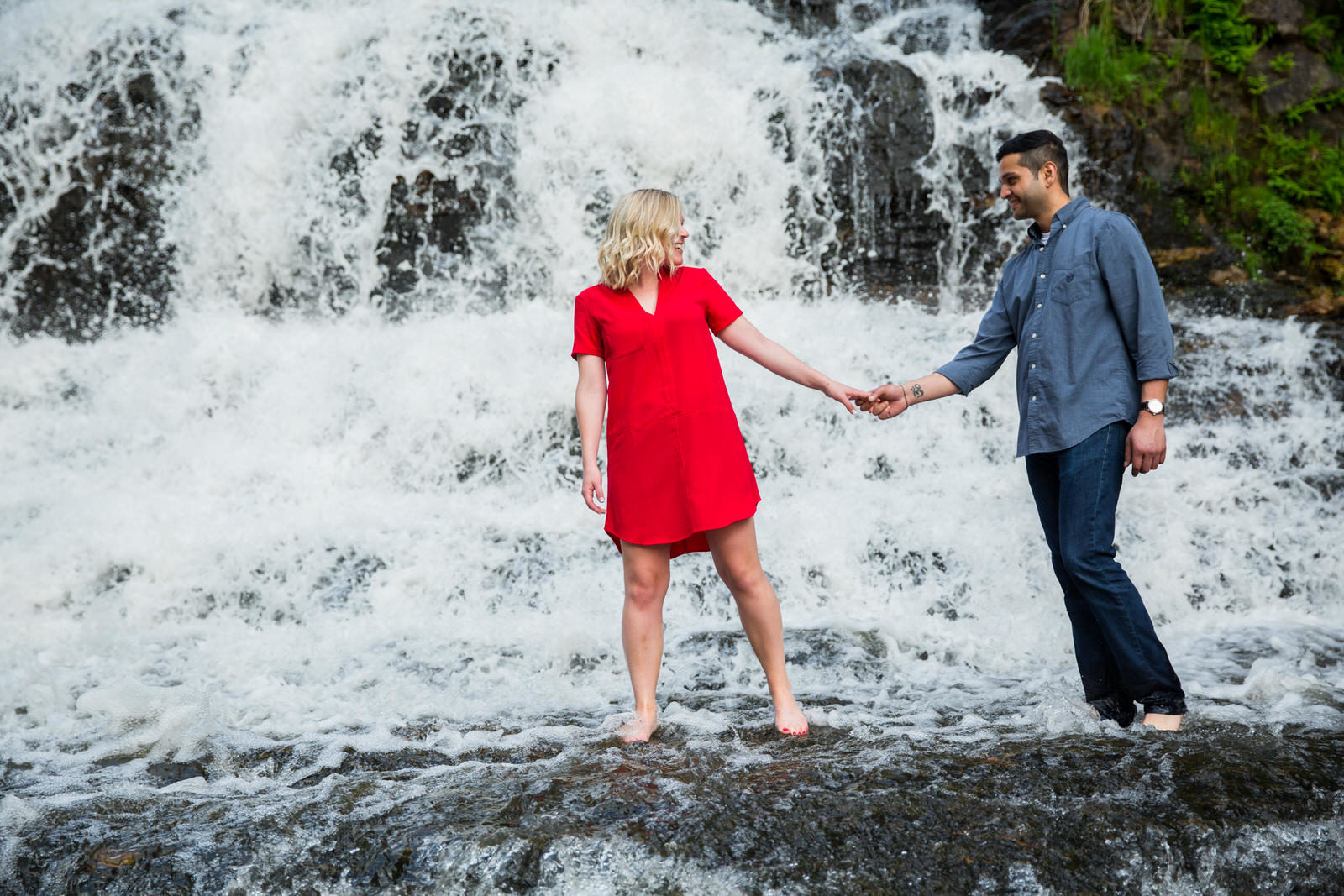 waterfall engagement couple red dress