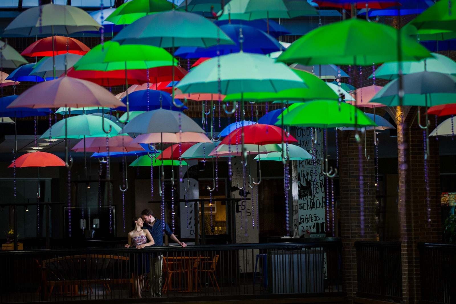 Uptown Engagement Session couple under umbrellas