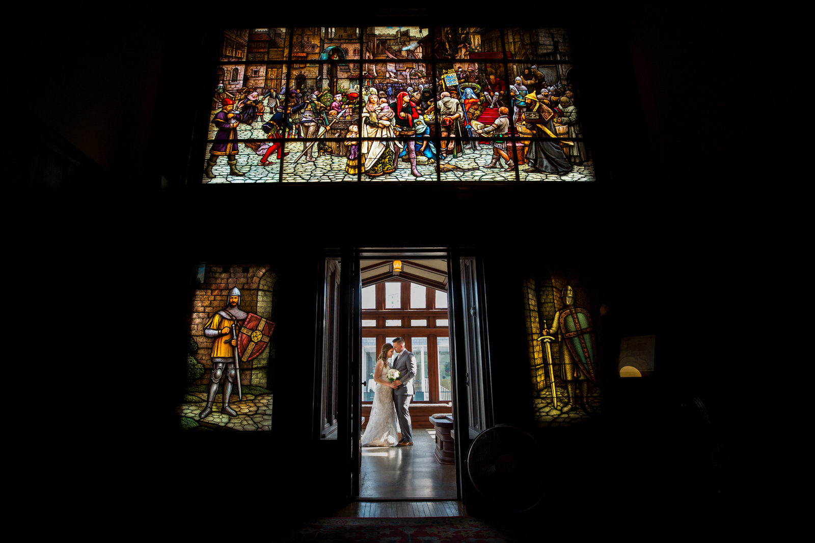 American Swedish Institute Wedding couple under stained glass