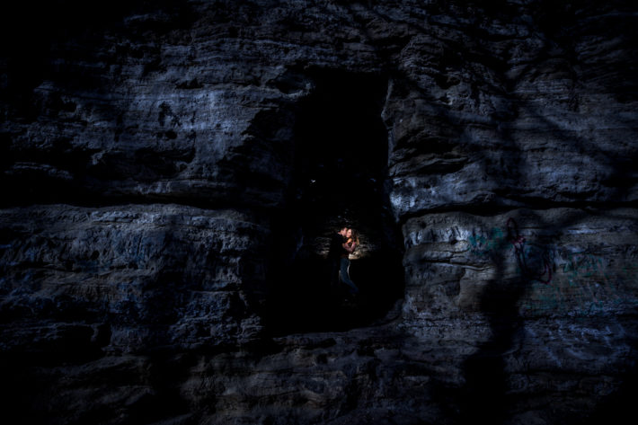 Stillwater Engagement Session couple embrace in silvery cave
