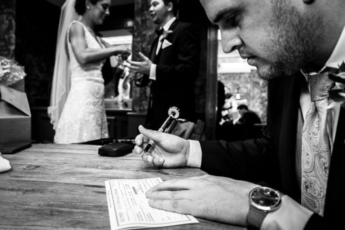 Calhoun Beach Club Wedding signing the papers