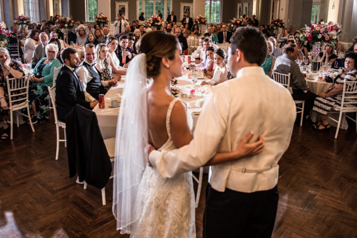couple speaking in front of guests
