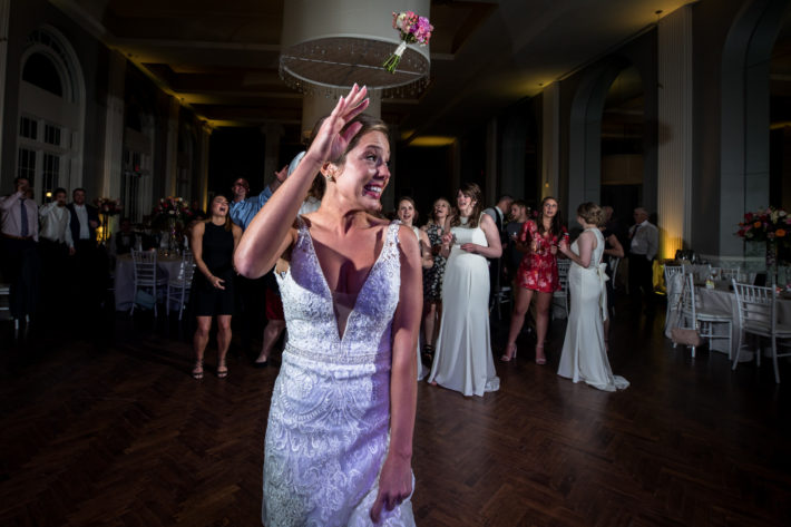 Calhoun Beach Club Wedding bridge throwing bouquet