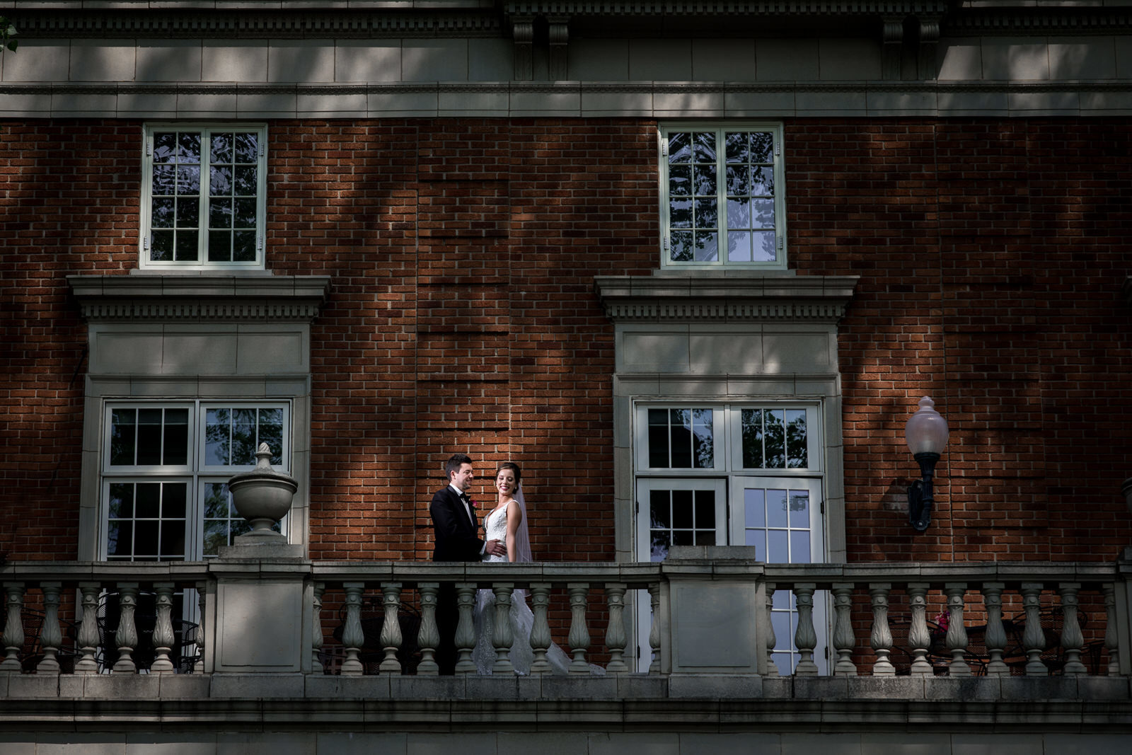 Calhoun Beach Club Wedding couple on red brick balcony