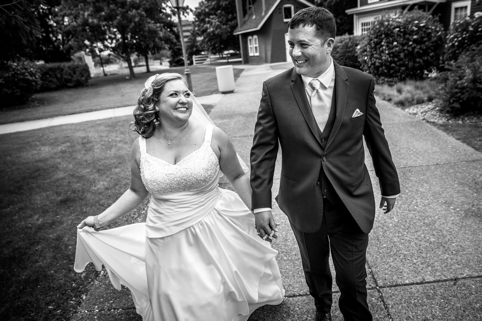 Earle Brown Wedding couple walking together in black and white
