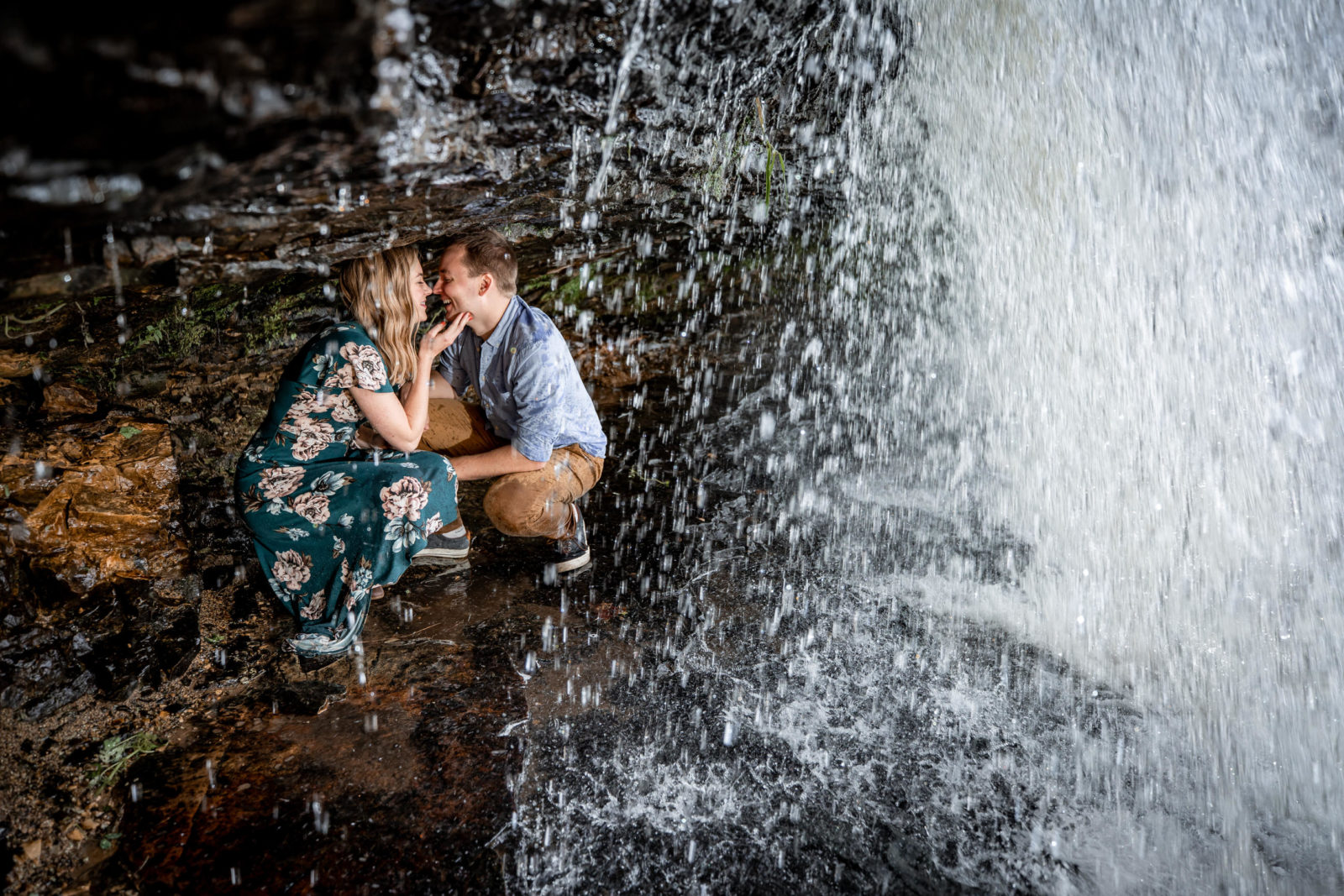 under a waterfall fall engagement