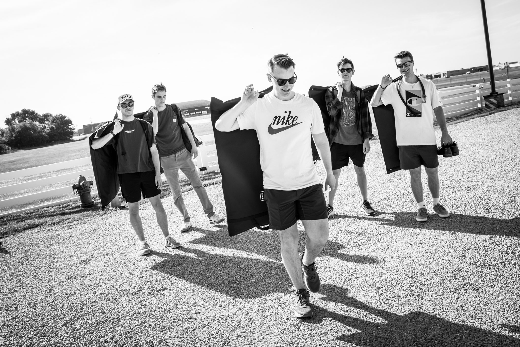 Groom and Groomsmen game day walk into Green Acres Venue.