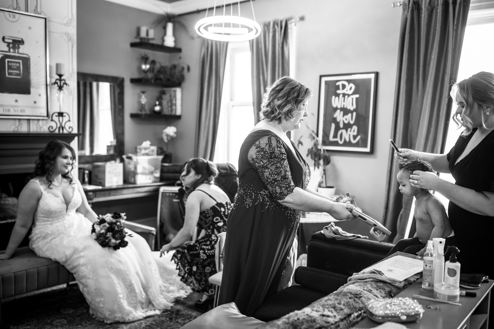 A candid scene of everyone getting ready before a wedding,