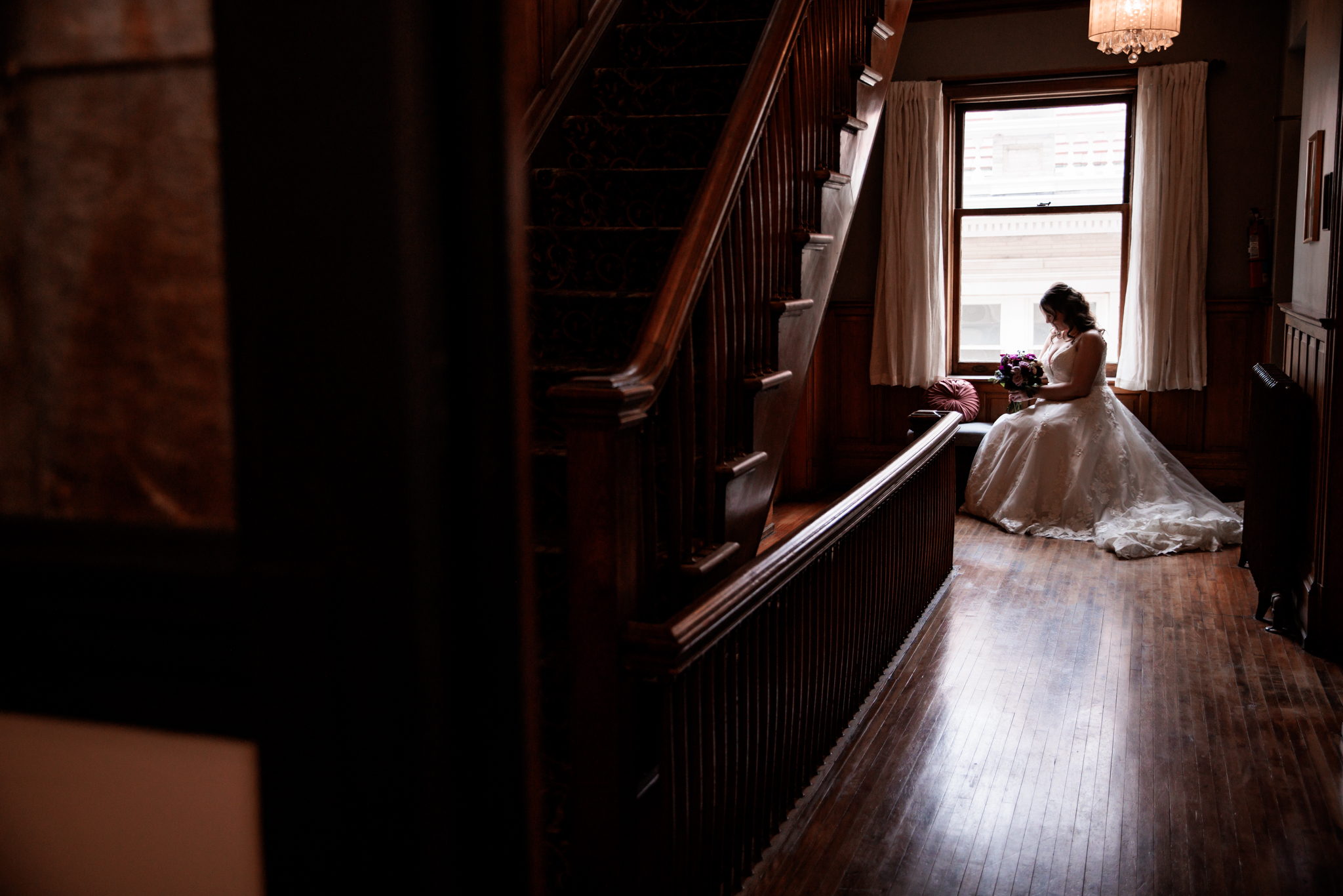 A bridal portrait sitting by the window in the Semple Mansion.